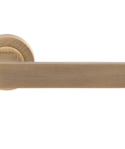 Sasso Door Handles On Round Rose, Antique Brass (sold in pairs)