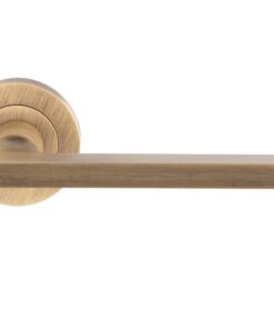 Trentino Door Handles On Round Rose, Antique Brass (sold in pairs)