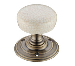 Ivory Crackle Glaze Porcelain Door Knobs, Florentine Bronze (sold in pairs)