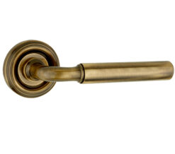 Parisian Elise Door Handles On Round Rose, Antique Brass  (sold in pairs)