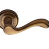 Heritage Brass Lisboa Antique Brass Door Handles On Round Rose -   (sold in pairs)