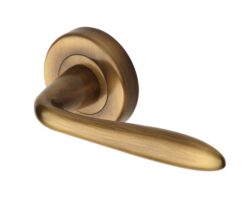 Heritage Brass Sutton Antique Brass Door Handles On Round Rose  (sold in pairs)
