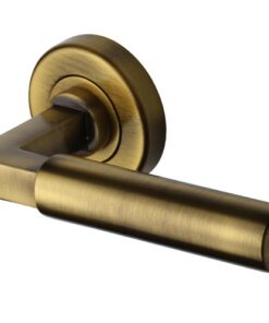 Heritage Brass Bauhaus Antique Brass Door Handles On Round Rose - (sold in pairs)