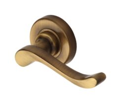 Heritage Brass Bedford Antique Brass Door Handles On Round Rose   (sold in pairs)