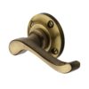 Heritage Brass Bedford Antique Brass Door Handles On Round Rose (sold in pairs)