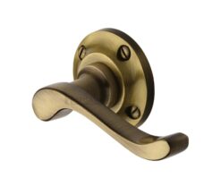 Heritage Brass Bedford Antique Brass Door Handles On Round Rose   (sold in pairs)
